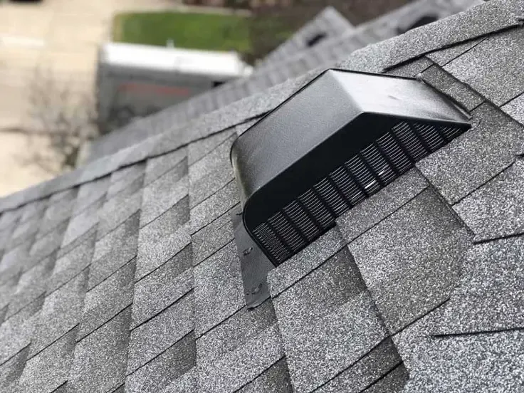 Gray attic ventilation system with black mesh screen